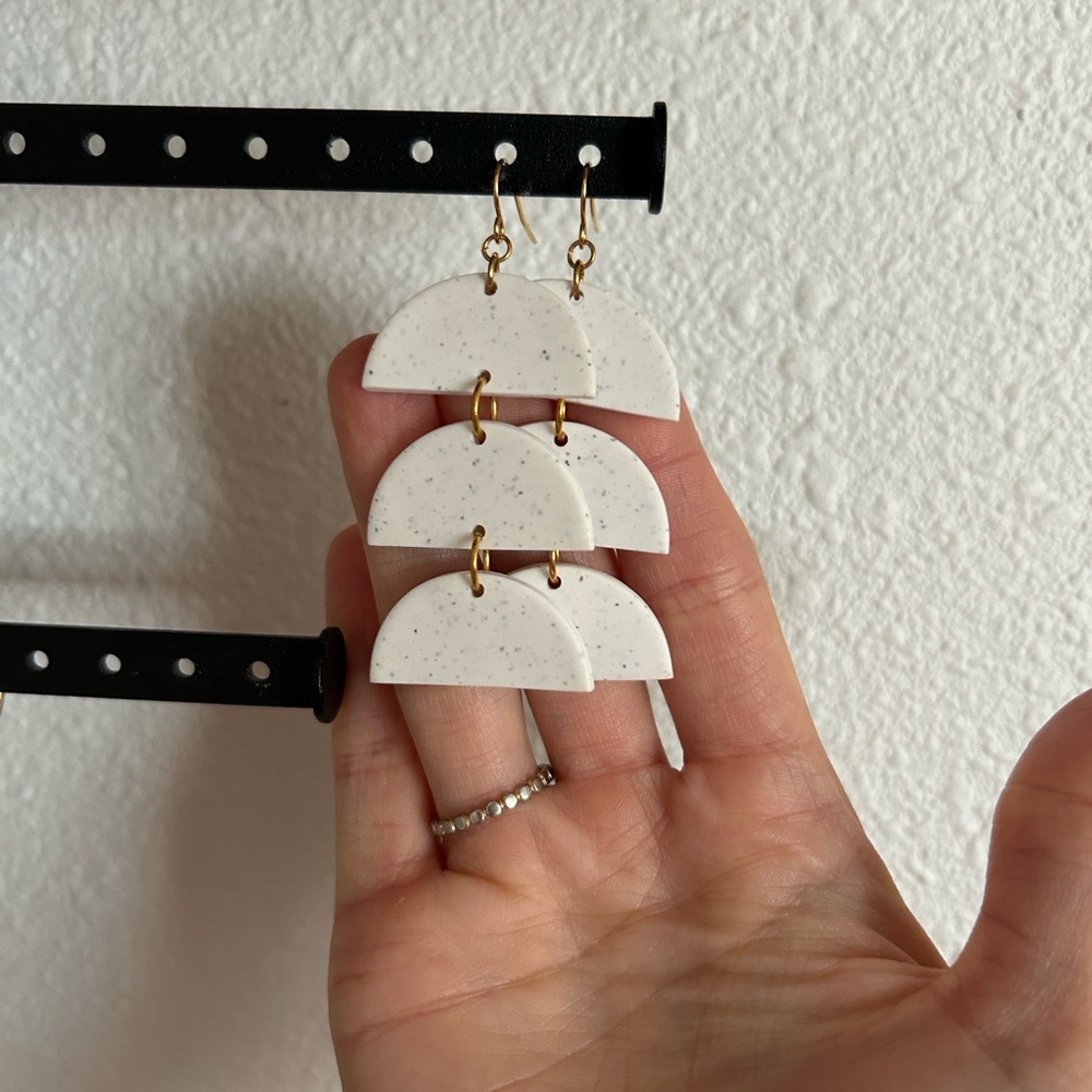 White speckled clay half-circle dangly earrings